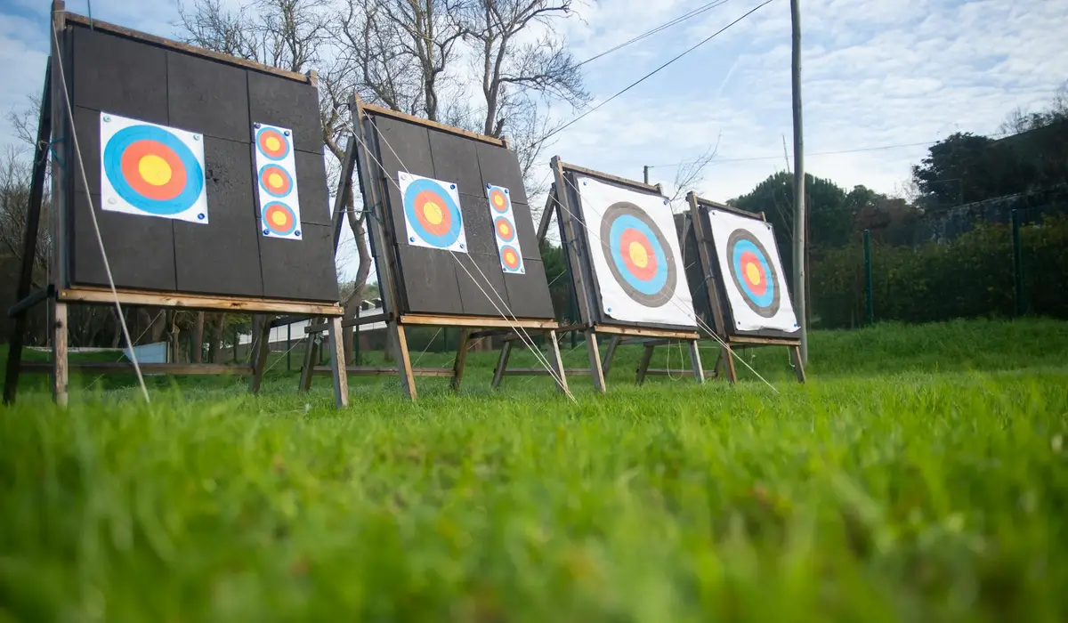 Row of archery targets set up on a grassy outdoor field